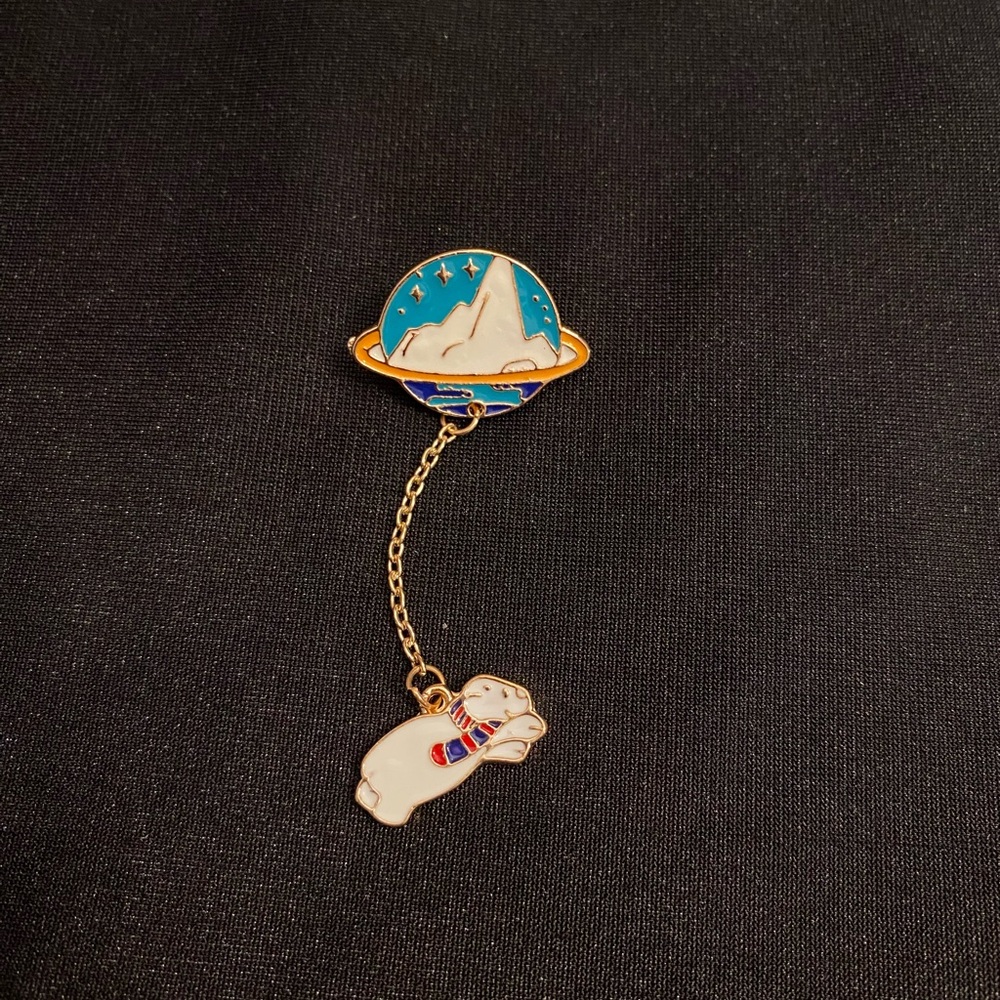 Space Polor Bear takes a celestial trip on this enamel pin/magnet 3FER